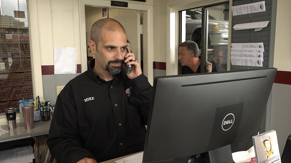 Employment | Elite Auto Repair - Mike on phone with client